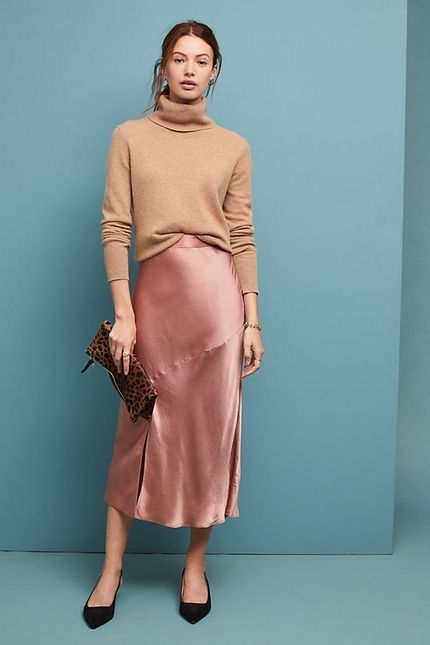 Camel turtleneck sweater with a pink silk midi skirt